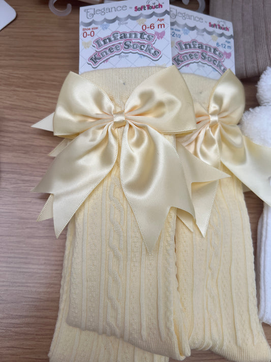 Yellow girls knee bow socks.